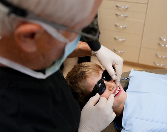 Dentist Checking Child's Tooth — Suncoastdental In Maroochydore, QLD