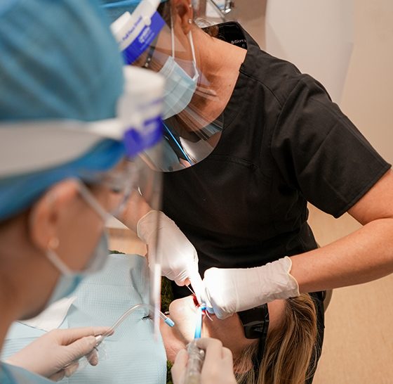 Dental Nurses In PPE Putting Sedation To Client — Suncoastdental In Maroochydore, QLD