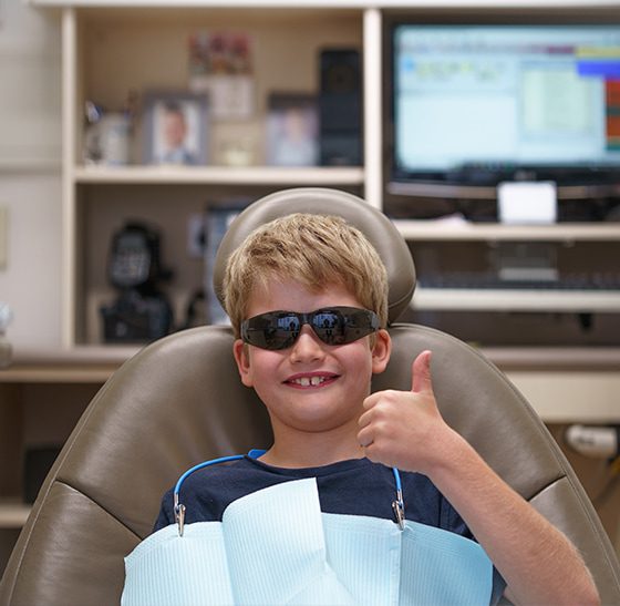 Kid Thumbs Up At the dentist — overcoming dental anxiety - Suncoast Dental