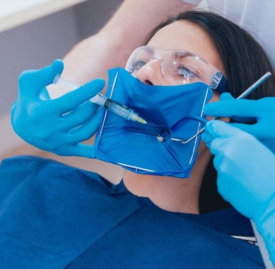 Dentist Injecting Sedation To A Patient — Suncoastdental In Maroochydore, QLD