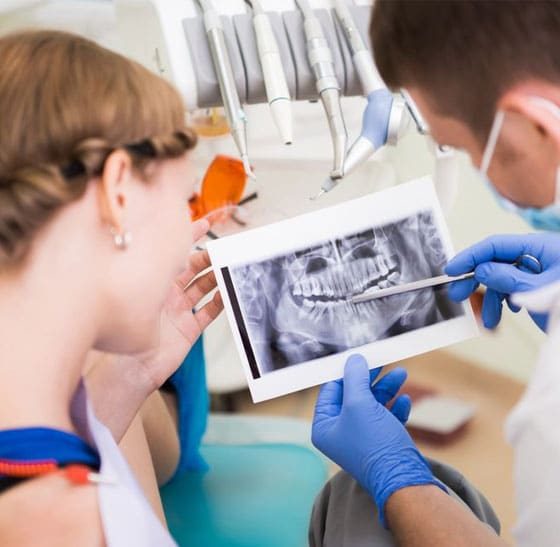 Patient Lying Down While Doing Dental Implant — Suncoastdental In Maroochydore, QLD